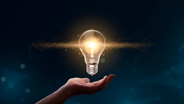 hand-holding-light-bulbs-abstract-600nw-2425815847